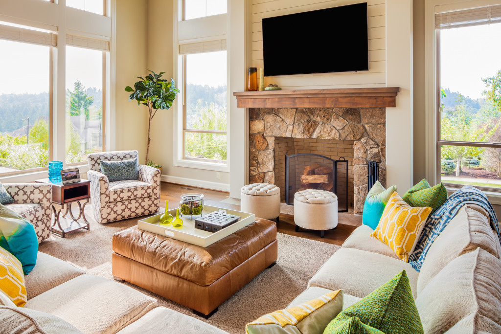 a beautiful living room with couches and storage ottomans